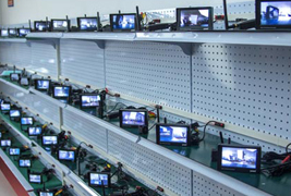 Factory burn-in racks with vehicle camera monitors under test